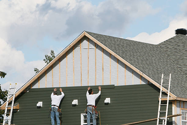Professional Siding technician working in Severn, MD